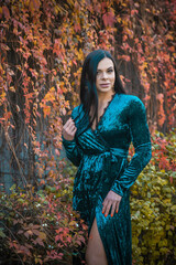 Woman in vintage style, blue velvet dress and retro accessorize 