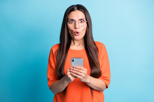 Portrait of attractive impressed person open mouth staring cant believe isolated on blue color background
