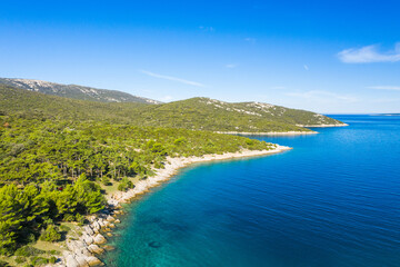 Fototapeta na wymiar Amazing seascape on Adriatic sea, long shore of the island of Losinj in Croatia, aerial view from drone