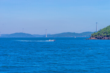 Hon Thom island in Phu Quoc, Vietnam, Asia - Tropical view with colorful houses, blue waves and blue sky, fishing boats and far away is a longest cable car
