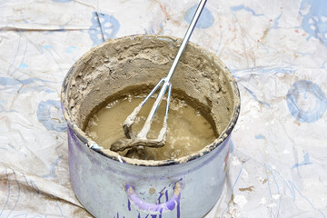 mixing the solution in container. construction, repair