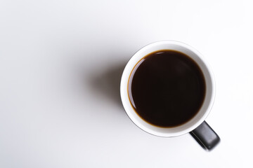 Black ceramic cup of dark coffee drink