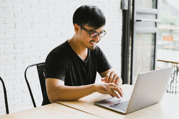 man work using computer hand typing laptop keyboard contact us.student study learning education online.adult professional people chatting search at office.concept for technology device business