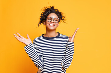 Excited ethnic woman in glasses