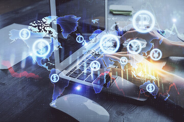 Double exposure of woman hands typing on computer and forex chart hologram drawing. Stock market...