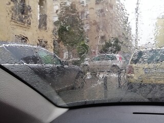 Driving in the rain through the city