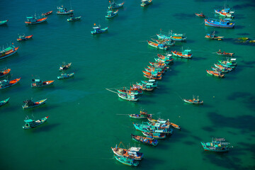 Fototapeta na wymiar Aerial view of traditional fishermen boats lined in An Thoi harbor of Duong Dong town in the popular Phu Quoc island, Vietnam, Asia.