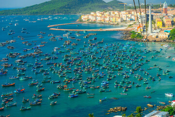 Fototapeta premium Aerial view of traditional fishermen boats lined in An Thoi harbor of Duong Dong town in the popular Phu Quoc island, Vietnam, Asia.