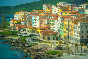 Fototapeta premium Aerial view of Phu Quoc city with beautiful houses, buildings and coast line. Tropical village in Phu Quoc island, Vietnam, Asia.