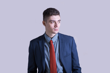 Portrait of a young and stylish boy in a suit