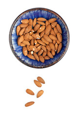 A bowl filled with almonds. Studio photo isolated on white background. Selective focus on object.