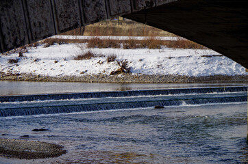 Winter wonderland landscape scenery at River Isar in dowtown Munich, great for walks in outdoor...