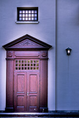 Door window and light against wall 