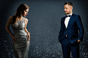 Fashion Luxury Couple. Glamour Woman and Handsome Man. Elegant Pair in evening Dress and Suit....