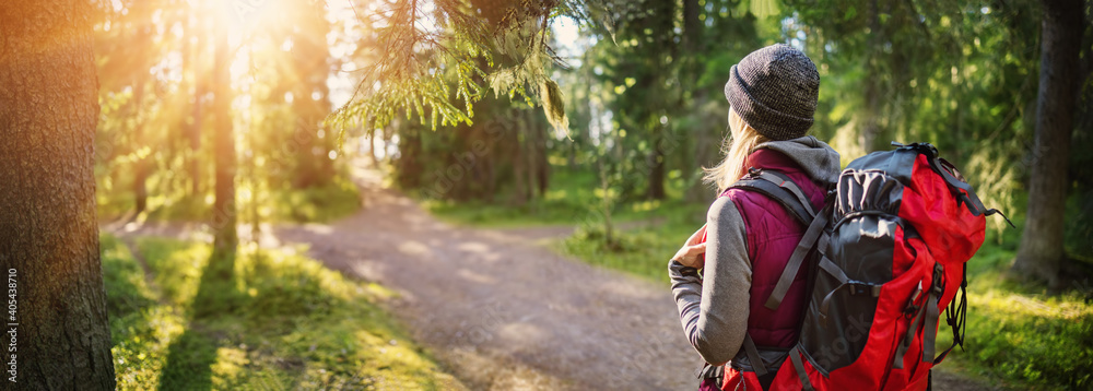 Wall mural woman hiking and going camping in nature