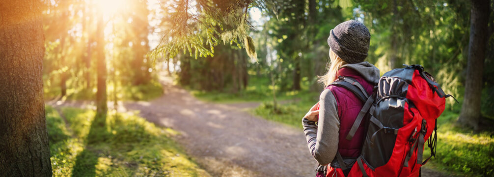 Woman hiking and going camping in nature