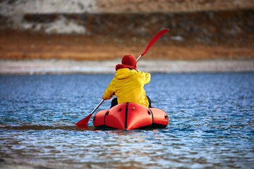 Swim in Packraft. Packraft, one-person light raft, used for expedition or adventure racing on a...