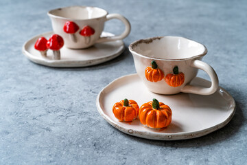 Handmade Ceramic Coffee or Tea Cups with Pumpkin and Mushroom Pattern Figure Design Handcrafted. Handicraft.