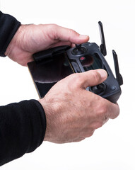 Hand hold drone controller isolated on white background.