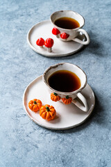 Handmade Ceramic Coffee or Tea Cups with Pumpkin and Mushroom Pattern Figure Design Handcrafted. Handicraft.