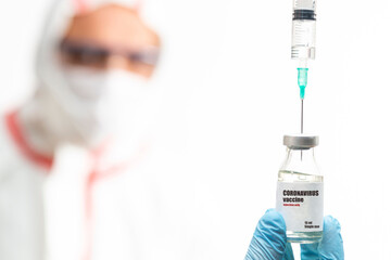 Doctor holding syringe with Corona Covid-19 virus vaccine