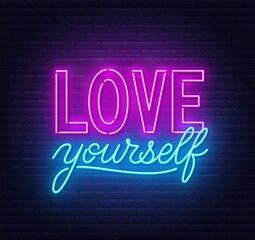 Fototapeta na wymiar Love yourself neon quote on a brick wall. Inspirational glowing lettering.