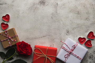 Valentine's Day, Gift box with a ribbon, candles and rose. - 405449310