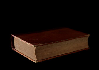 Old antique, ancient book isolated on black background with clipping path
