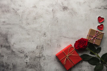Valentine's Day, Gift box with a ribbon, candles and rose. - 405449706