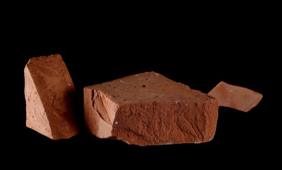 Broken brick chunks isolated on black background with clipping path