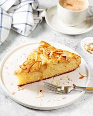 Traditional Norwegian apple pie with cinnamon and almond petals. Scandinavian baking	