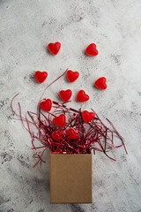 Valentine's Day, Gift box of kraft paper with a red heart candy - 405450578