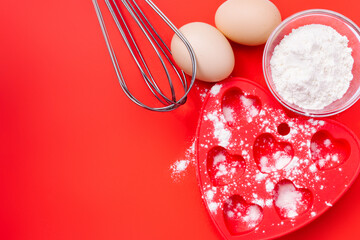Wheat flour, baking dish and cupcake whisks for your breakfast. Valentine's Day.