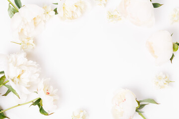 Flowers composition. Frame made of pink peony flowers on white background. Flat lay, top view, copy space