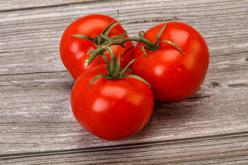 Red bright ripe tomato branch