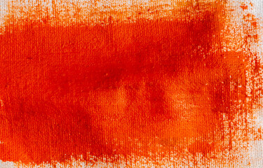 Orange paint on cotton fabric