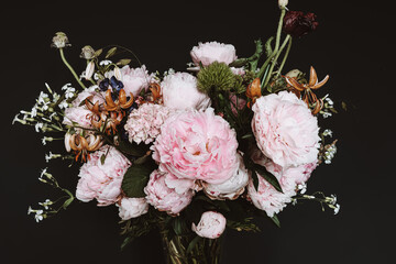Beautiful bouquet of different flowers on black background. F