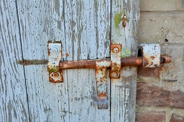 Old lock on a wooden door 