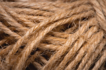 Natural rope twine textured background close up plan. Fibers in a mess rustic style