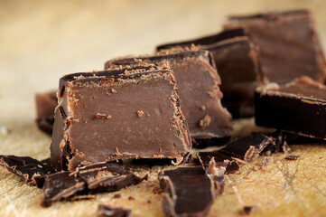 Pieces of chocolate candy closeup. Shallow depth of field