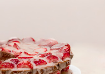 Pastries with red berries and white cream. Cake with strawberries and sour cream. Close-up. Food. Copy space. Selective focus.