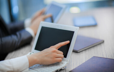 close up. business woman using laptop at work meeting.