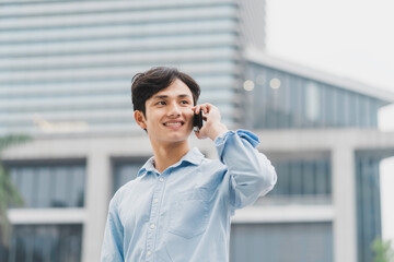 Asian businessman is calling outside
