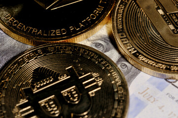Fototapeta na wymiar Franklin looks out over bitcoin. coin with bitcoin logo on a hundred dollar bill
