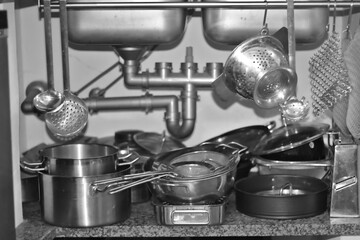 kitchen utensils stored below the sink