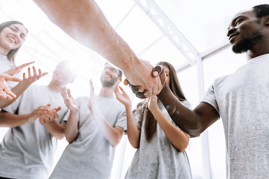 close up. two young opponents shake hands.