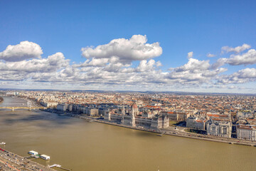 Aerial drone shot of Hungarian Parliament by Danube from Buda hill in Budapest winter morning