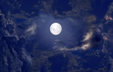 The full moon between the clouds in the night sky - 405463187