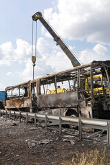 Crane Lift Burnt Coach Bus
