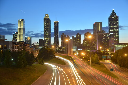 High Angle View Of Illuminated Street Amidst Buildings At Night